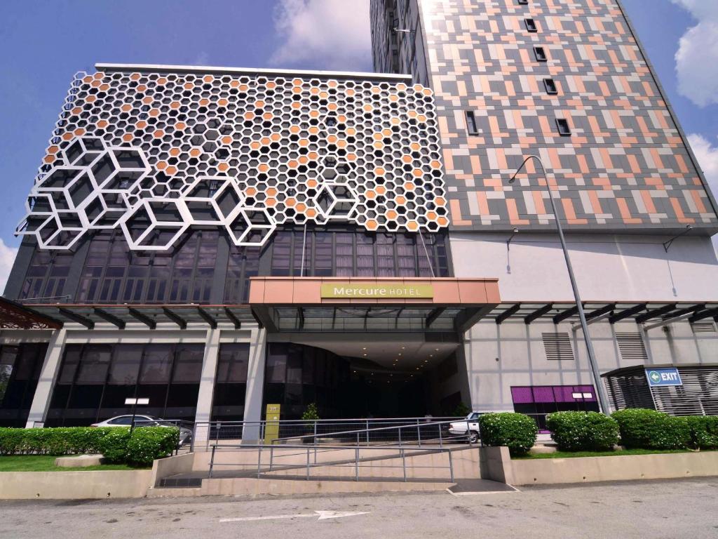 a building with a large building with at Mercure Selangor Selayang in Batu Caves