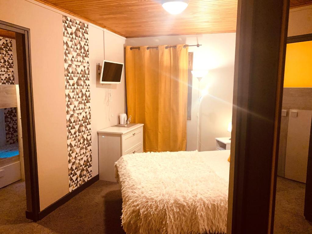 Postel nebo postele na pokoji v ubytování Hotel Le Beau Site