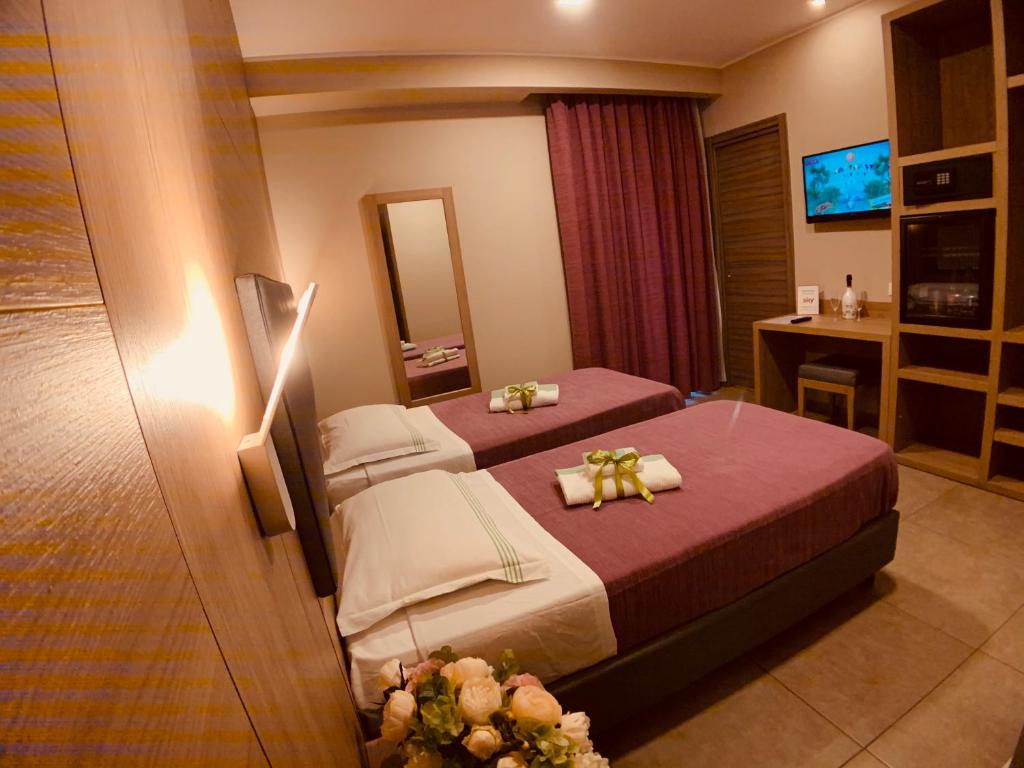 Postel nebo postele na pokoji v ubytování Hotel Smeraldo
