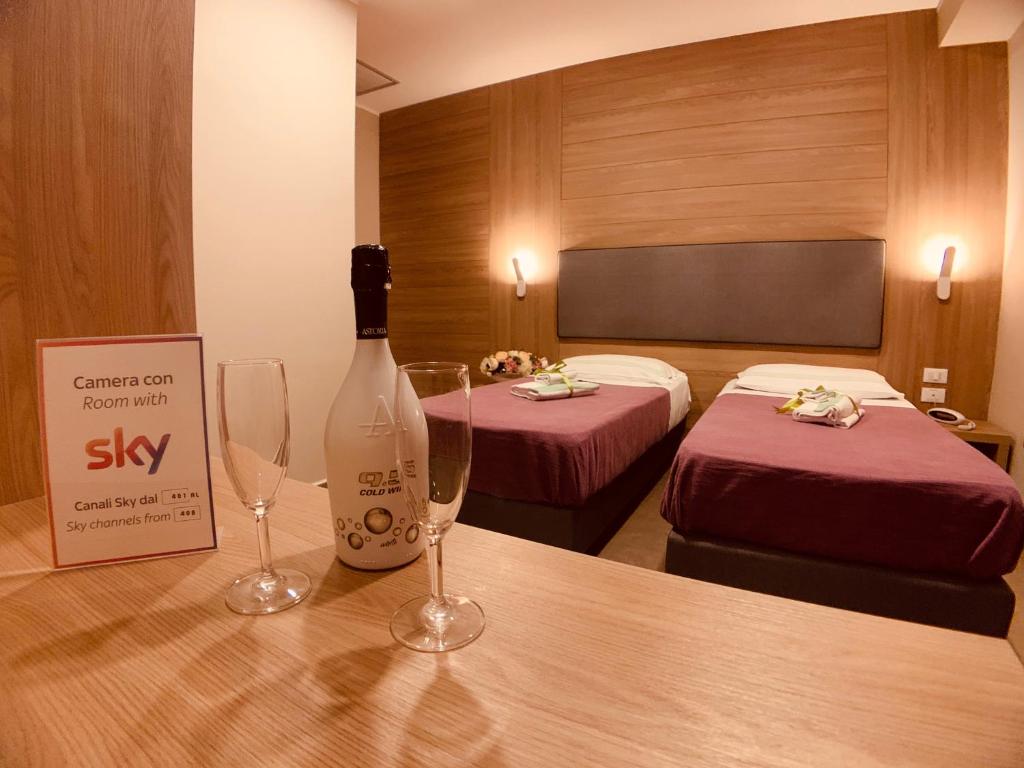 Postel nebo postele na pokoji v ubytování Hotel Smeraldo