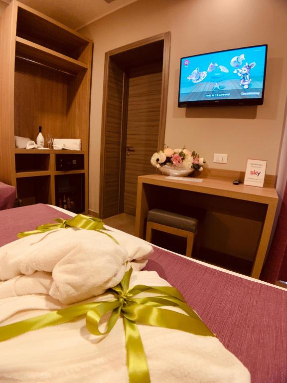 Postel nebo postele na pokoji v ubytování Hotel Smeraldo