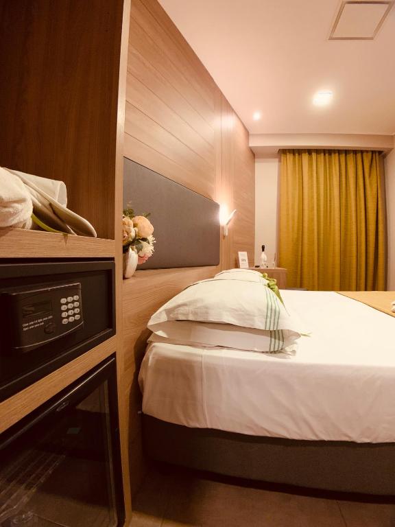 Postel nebo postele na pokoji v ubytování Hotel Smeraldo