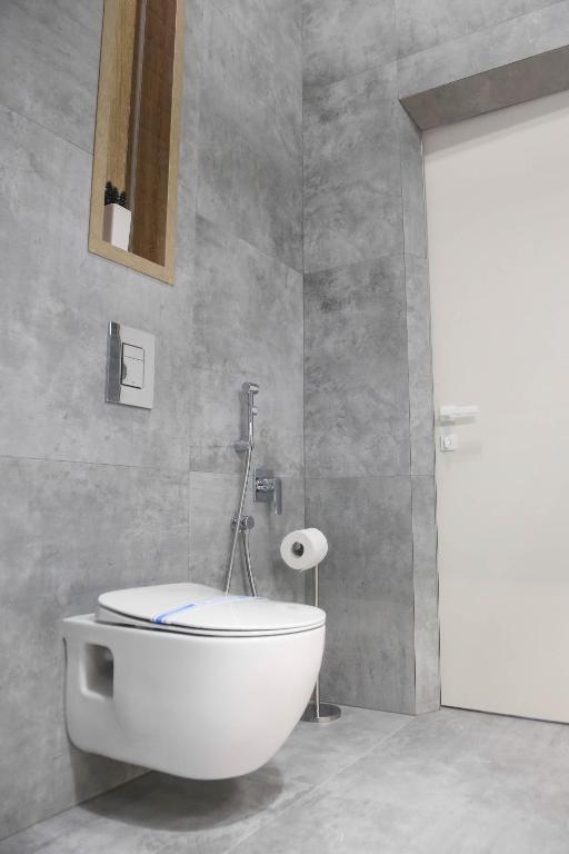 Koupelna v ubytování Apart Hotel на Трояндовой