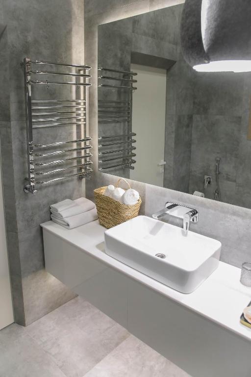Koupelna v ubytování Apart Hotel на Трояндовой