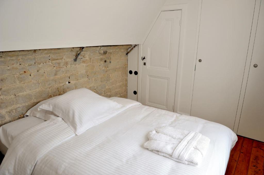 Postel nebo postele na pokoji v ubytování Guesthouse Bernardin