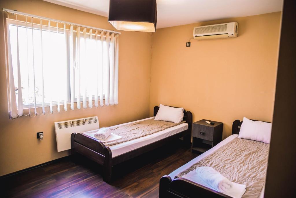 Postel nebo postele na pokoji v ubytování Guest House Vila Salute