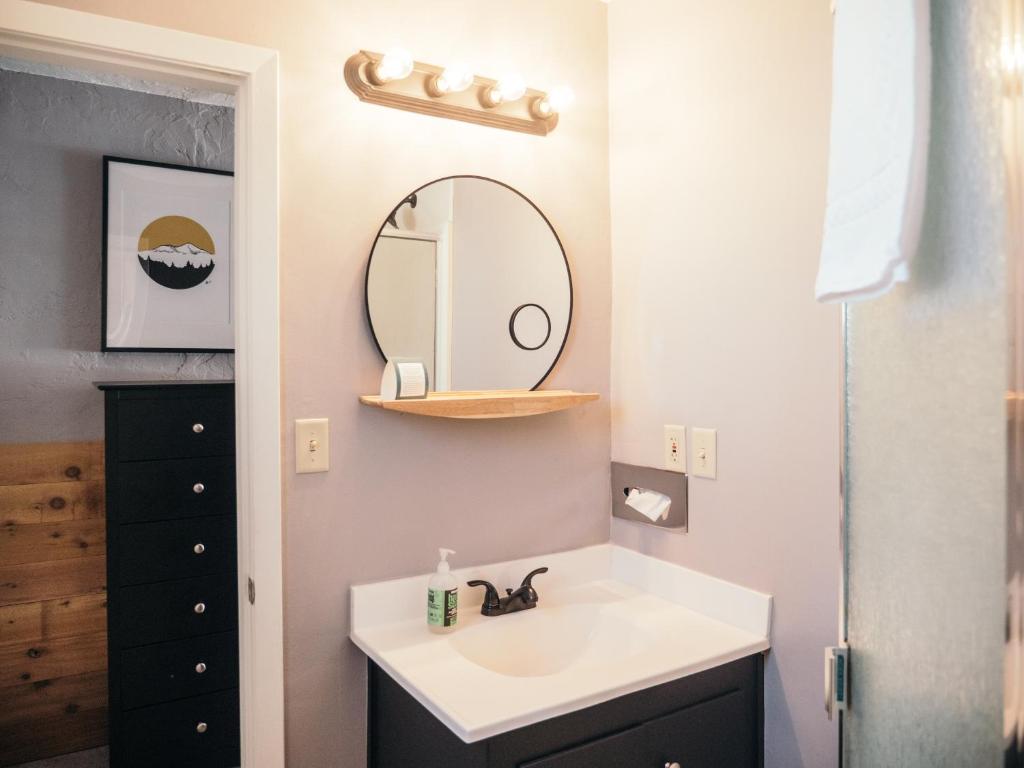 a bathroom with a sink and a mirror at LOGE Mt. Shasta in Mount Shasta