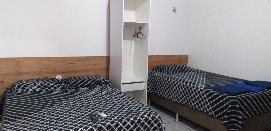 מיטה או מיטות בחדר ב-Apartamento por Temporada em Santarém no Pará