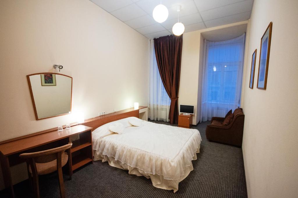 Кровать или кровати в номере Nevsky 136 Guest House