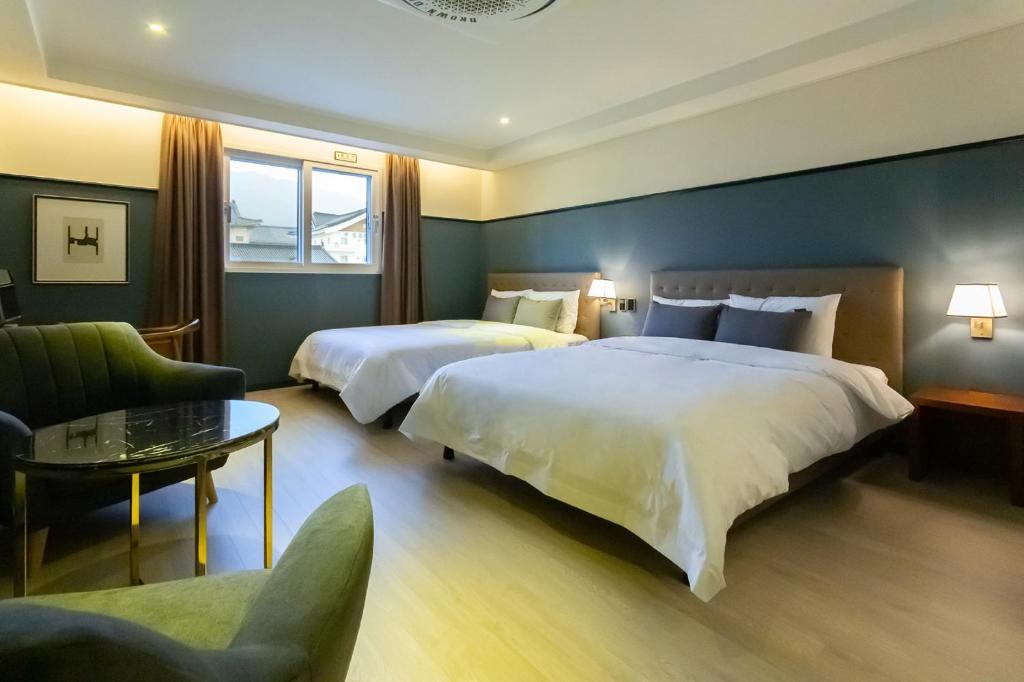 Postel nebo postele na pokoji v ubytování Brown Dot Hotel Gyeongju