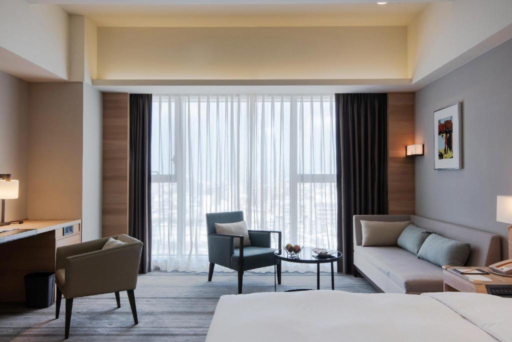 Postel nebo postele na pokoji v ubytování Hotel COZZI Ximen Tainan