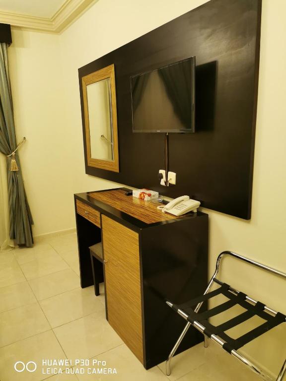 TV a/nebo společenská místnost v ubytování ديار المشاعر الهداية الفندقية Diyaralmashaer Al-Hadiyah Hotel