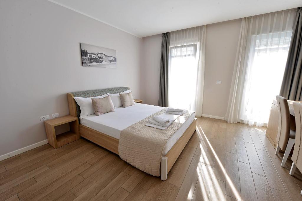 Postel nebo postele na pokoji v ubytování Alis Hotel