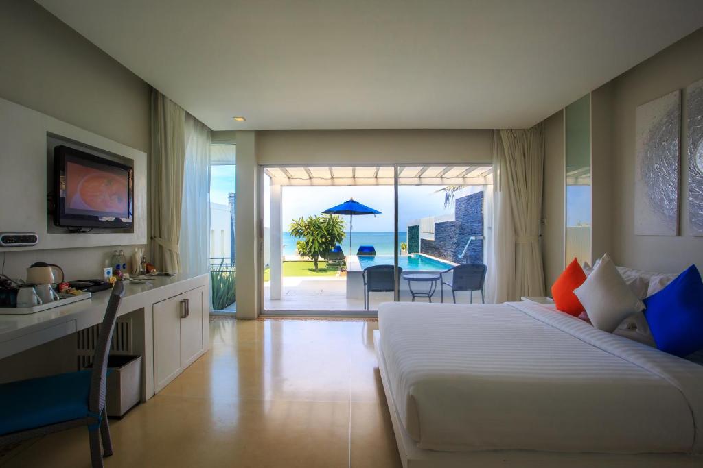 Postel nebo postele na pokoji v ubytování Samui Resotel Beach Resort