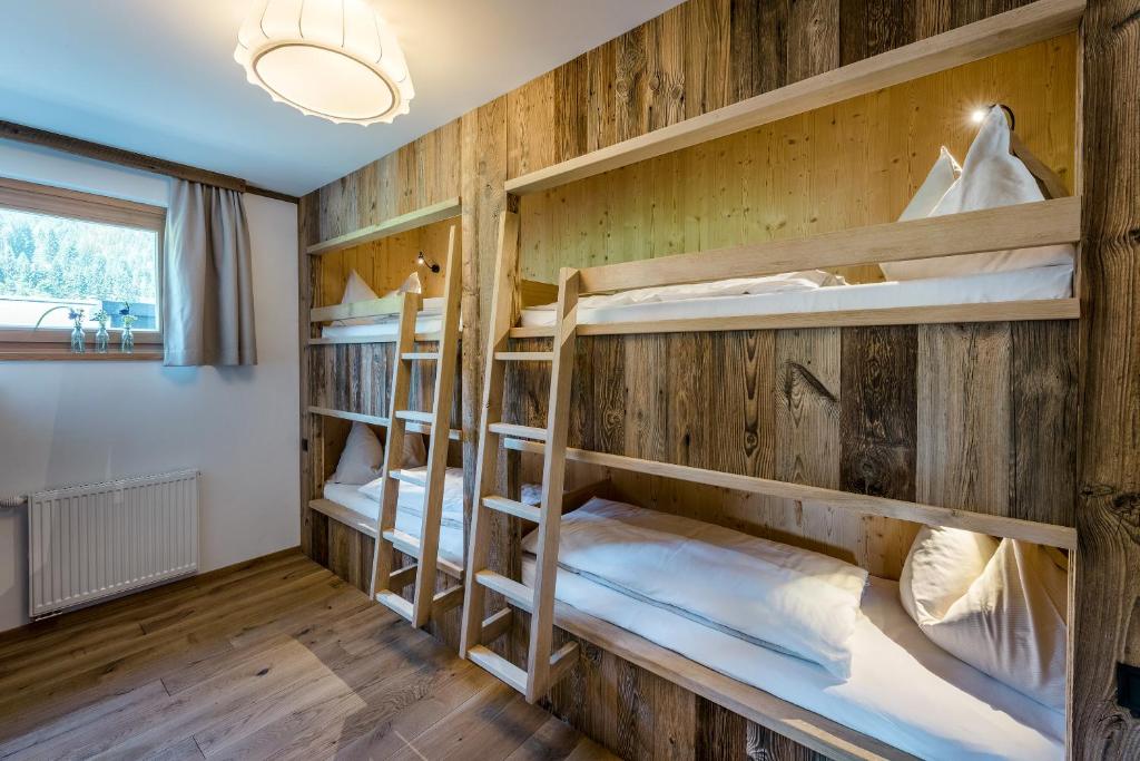 Postel nebo postele na pokoji v ubytování Almdorf Almlust