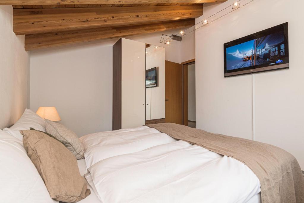 Postel nebo postele na pokoji v ubytování Chalet Monte Cristo