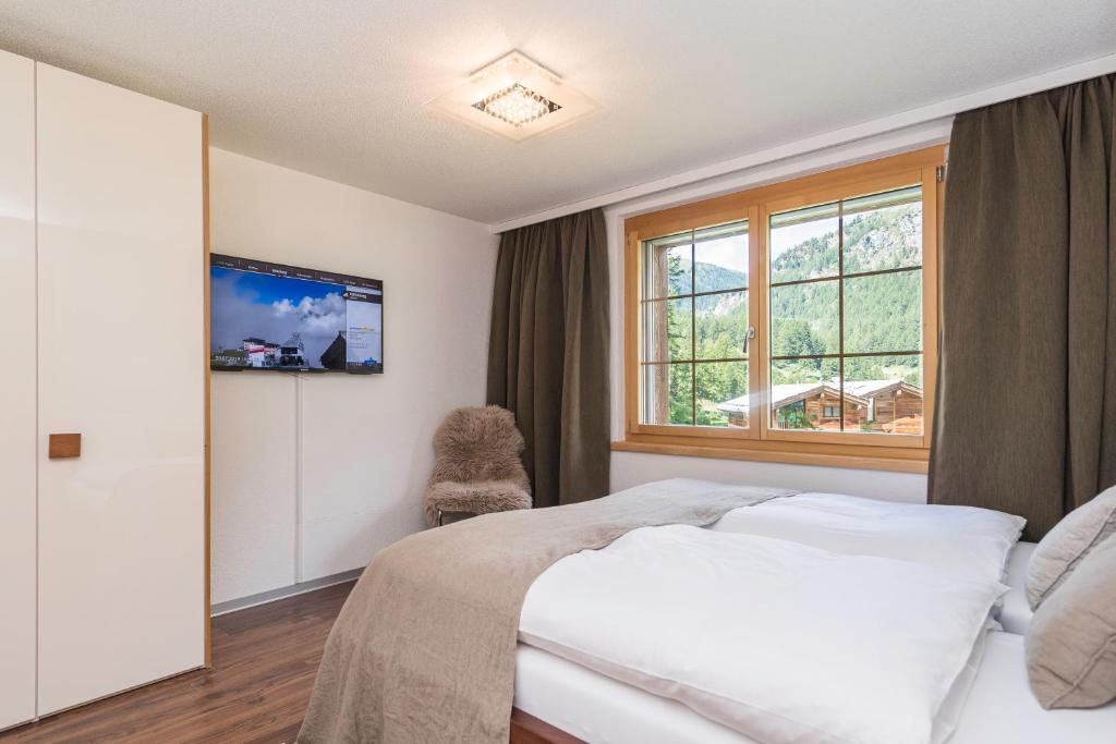 Postel nebo postele na pokoji v ubytování Chalet Monte Cristo