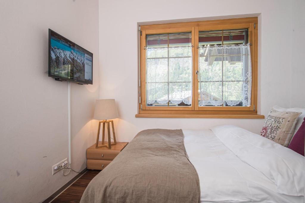 Postel nebo postele na pokoji v ubytování Chalet Monte Cristo