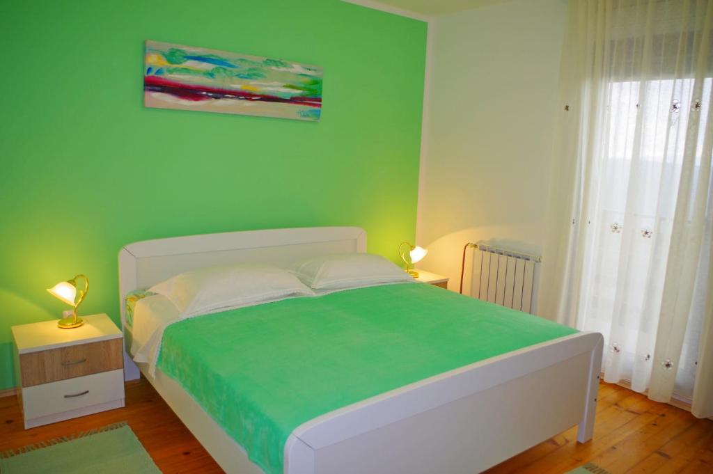 Posteľ alebo postele v izbe v ubytovaní Apartment Jadranka, Sutivanac - Risi