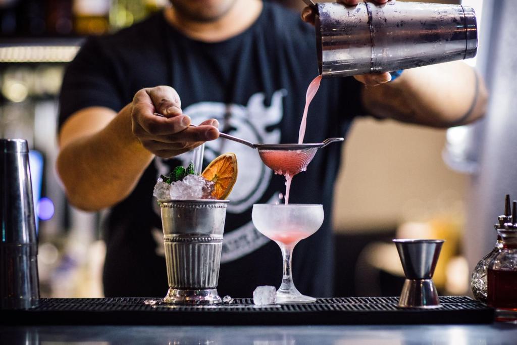 a man is making a drink in at Generator Stockholm in Stockholm