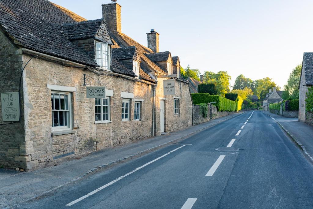 an empty street in an old stone village at The Boot at Barnsley in Cirencester
