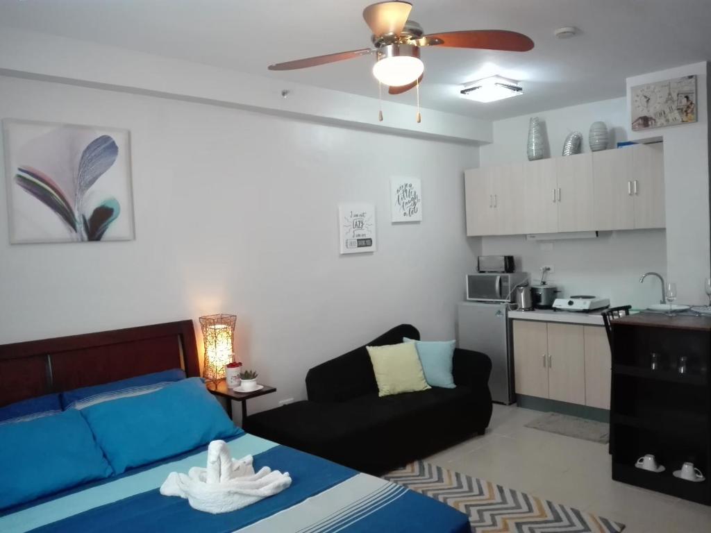 Kuchyň nebo kuchyňský kout v ubytování Mak'z Condo Place