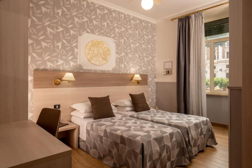 Postel nebo postele na pokoji v ubytování Hotel Dorica