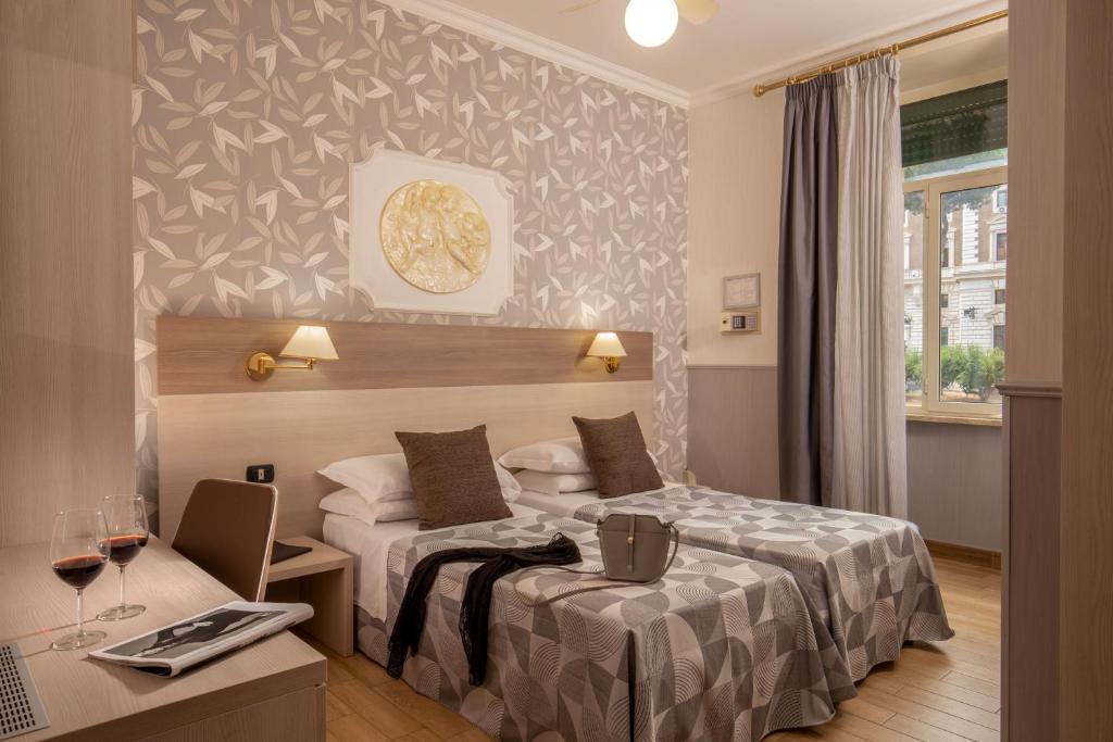 Postel nebo postele na pokoji v ubytování Hotel Dorica