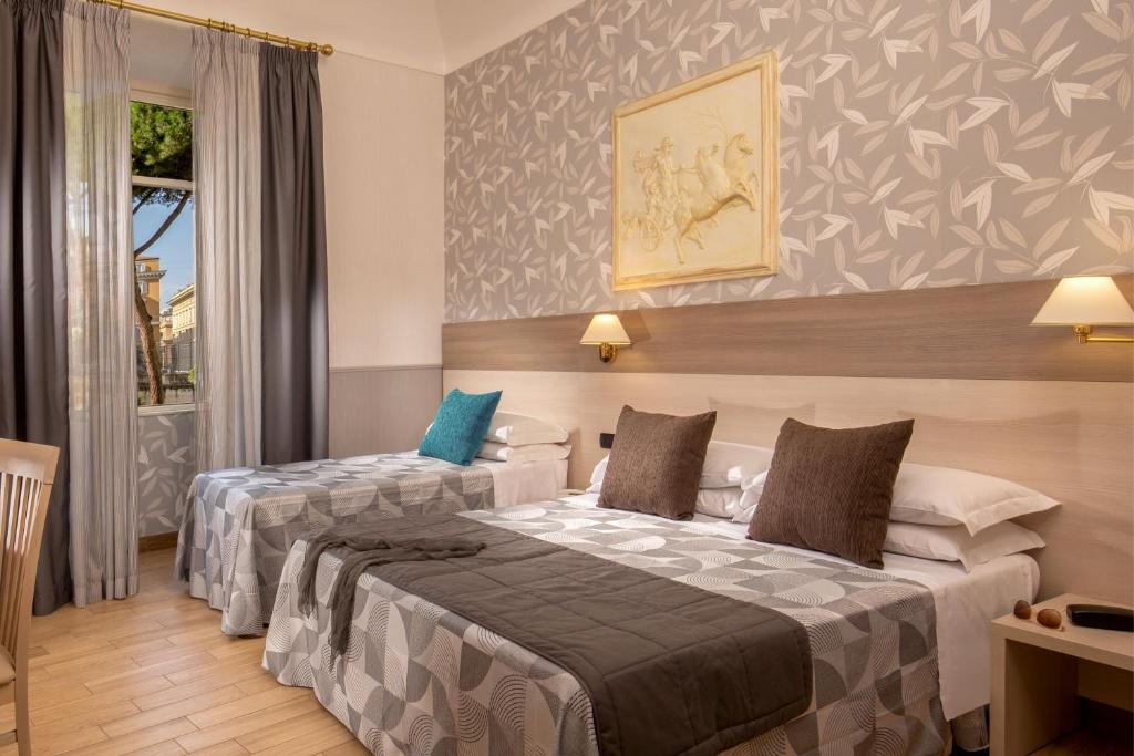 Postel nebo postele na pokoji v ubytování Hotel Dorica