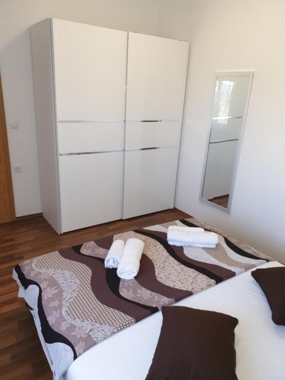 Postel nebo postele na pokoji v ubytování Apartmani Ivan