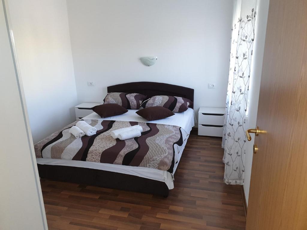 Postel nebo postele na pokoji v ubytování Apartmani Ivan