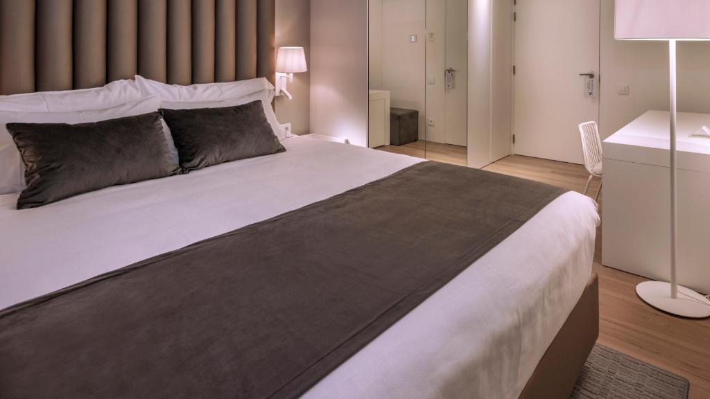 Postel nebo postele na pokoji v ubytování Hotel Playafels