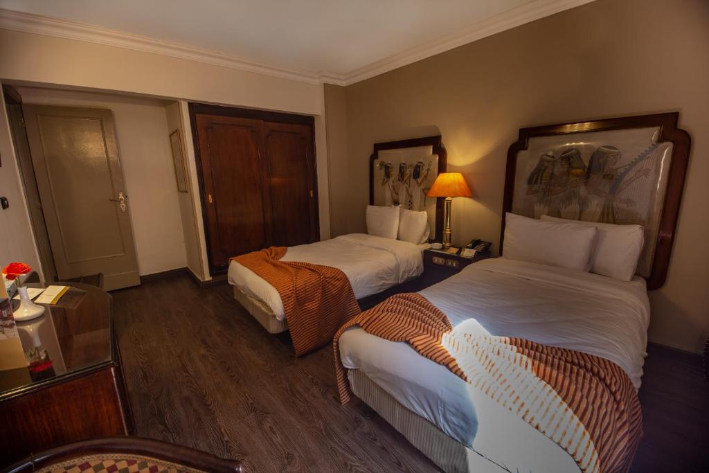 Postel nebo postele na pokoji v ubytování Zayed Hotel