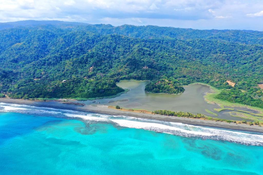 an aerial view of a beach and the ocean at LagunaVista Villas in Carate