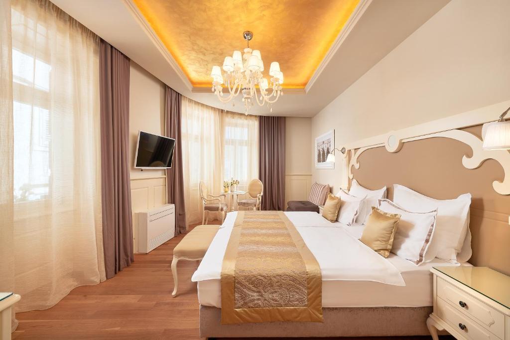 Posteľ alebo postele v izbe v ubytovaní Piazza Heritage Hotel