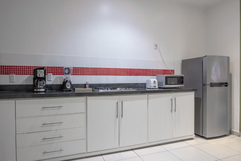 Kuchyň nebo kuchyňský kout v ubytování Apartamentos Torre II Condominios - Pet Friendly