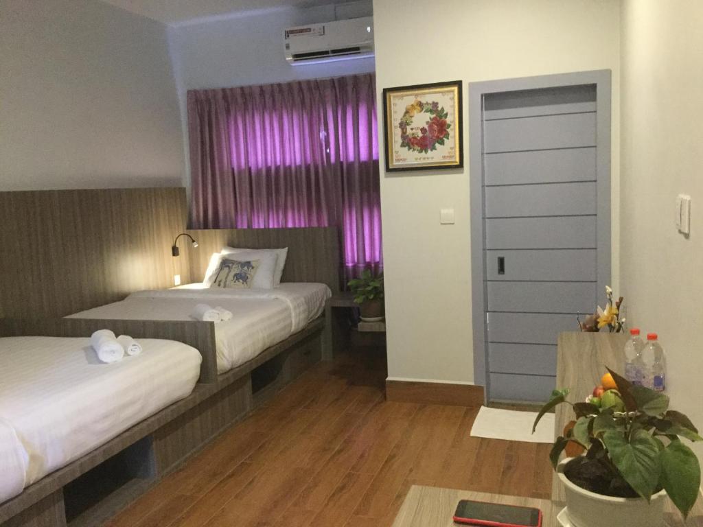 Postel nebo postele na pokoji v ubytování 2N Residence