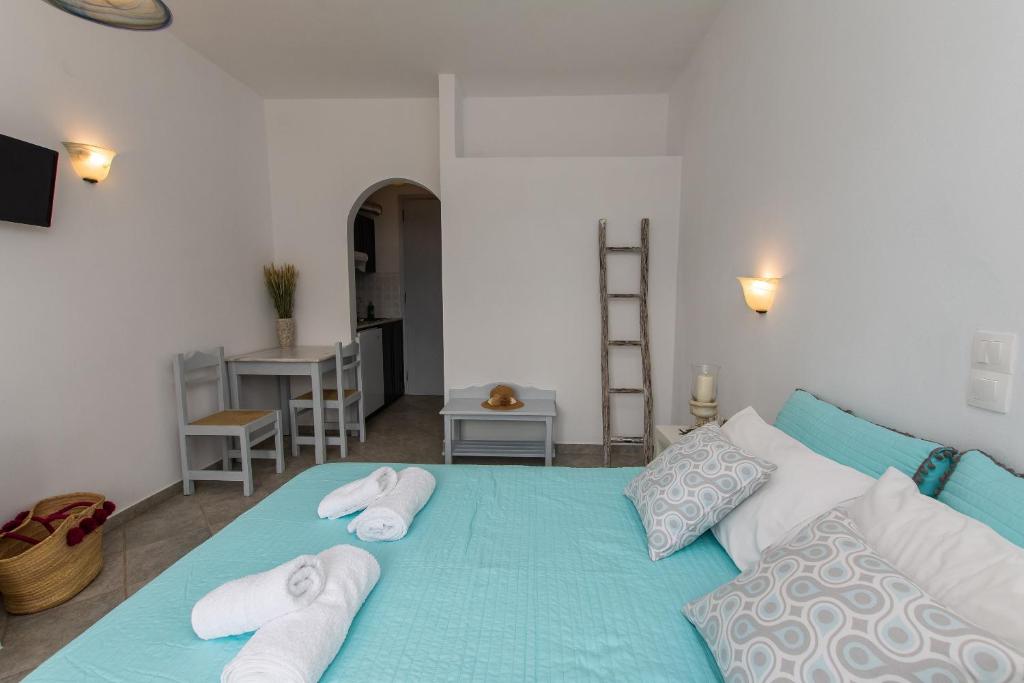 A bed or beds in a room at Studios Strouvalis