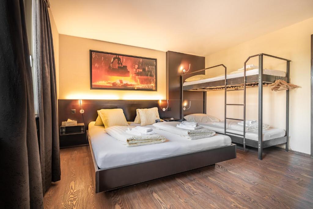 Letto o letti in una camera di feRUS Hotel