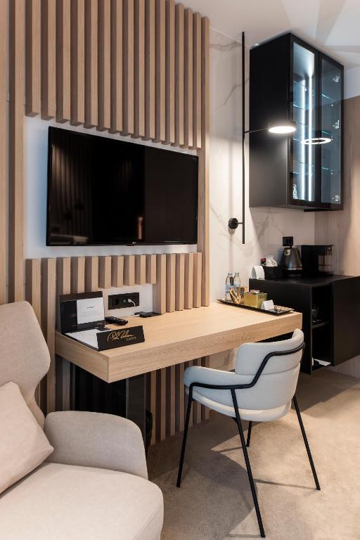 Televízia a/alebo spoločenská miestnosť v ubytovaní Pod Zidom Rooms