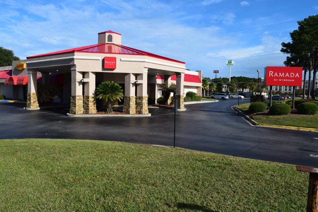 a mobil gas station with a red roof at Ramada by Wyndham Savannah Gateway in Savannah
