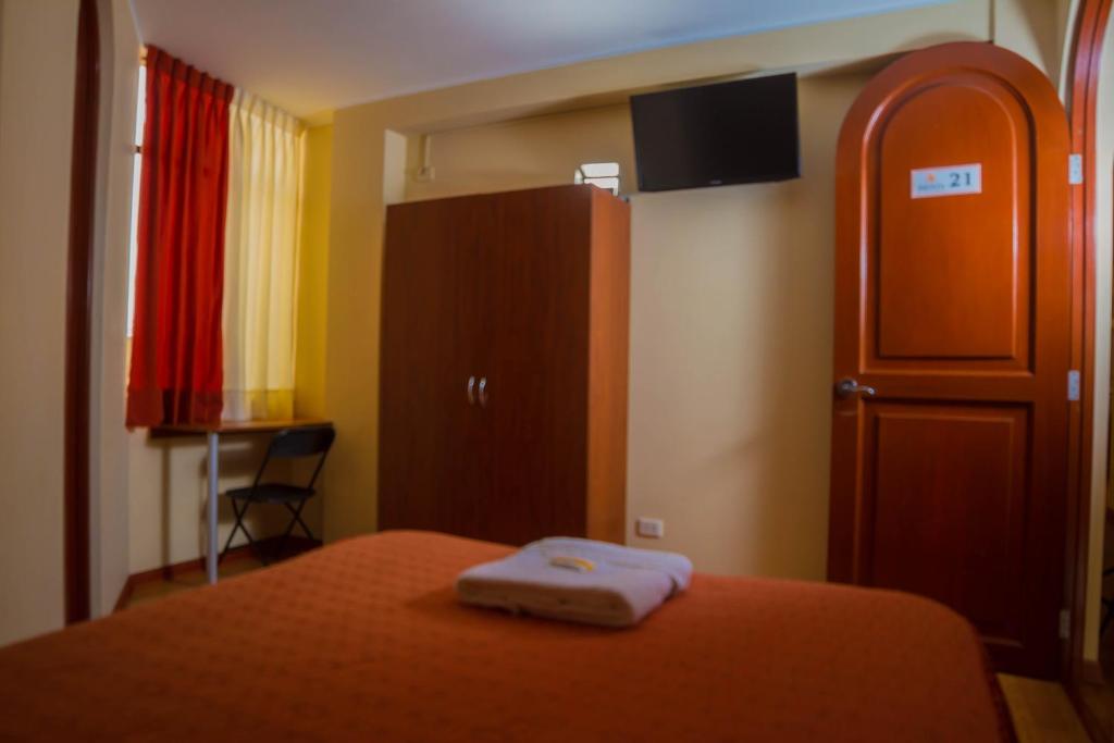 Postel nebo postele na pokoji v ubytování Hotel Arunta