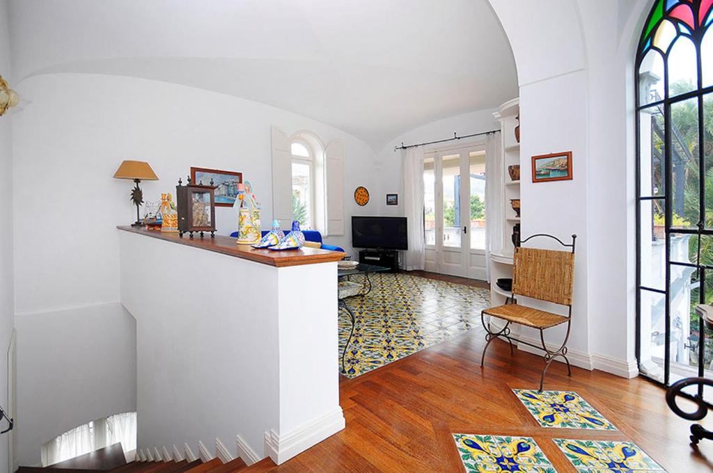 Telewizja i/lub zestaw kina domowego w obiekcie AMORE RENTALS - Villa Angelo