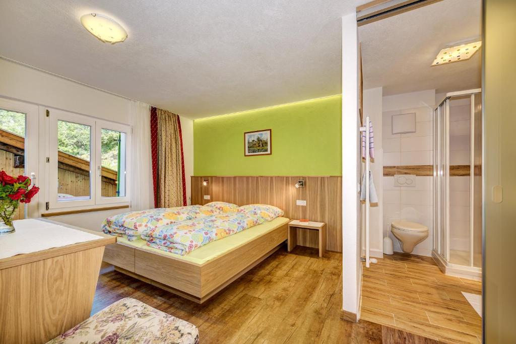 Postel nebo postele na pokoji v ubytování B & B Apartments Ortlerblick