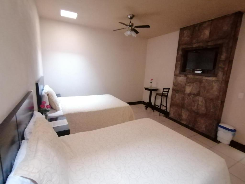 Postel nebo postele na pokoji v ubytování Hotel Peña Real