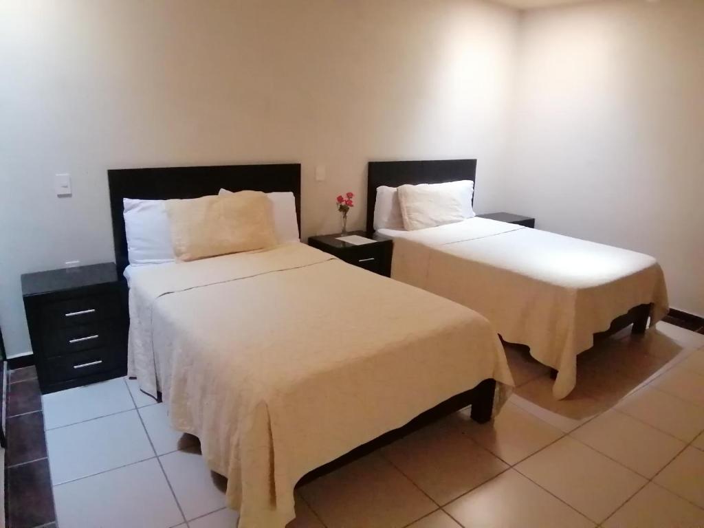 Postel nebo postele na pokoji v ubytování Hotel Peña Real
