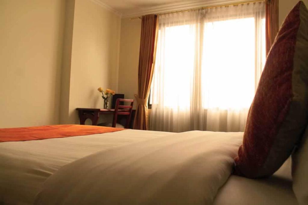 Postel nebo postele na pokoji v ubytování Hotel Splendor by Friends Company