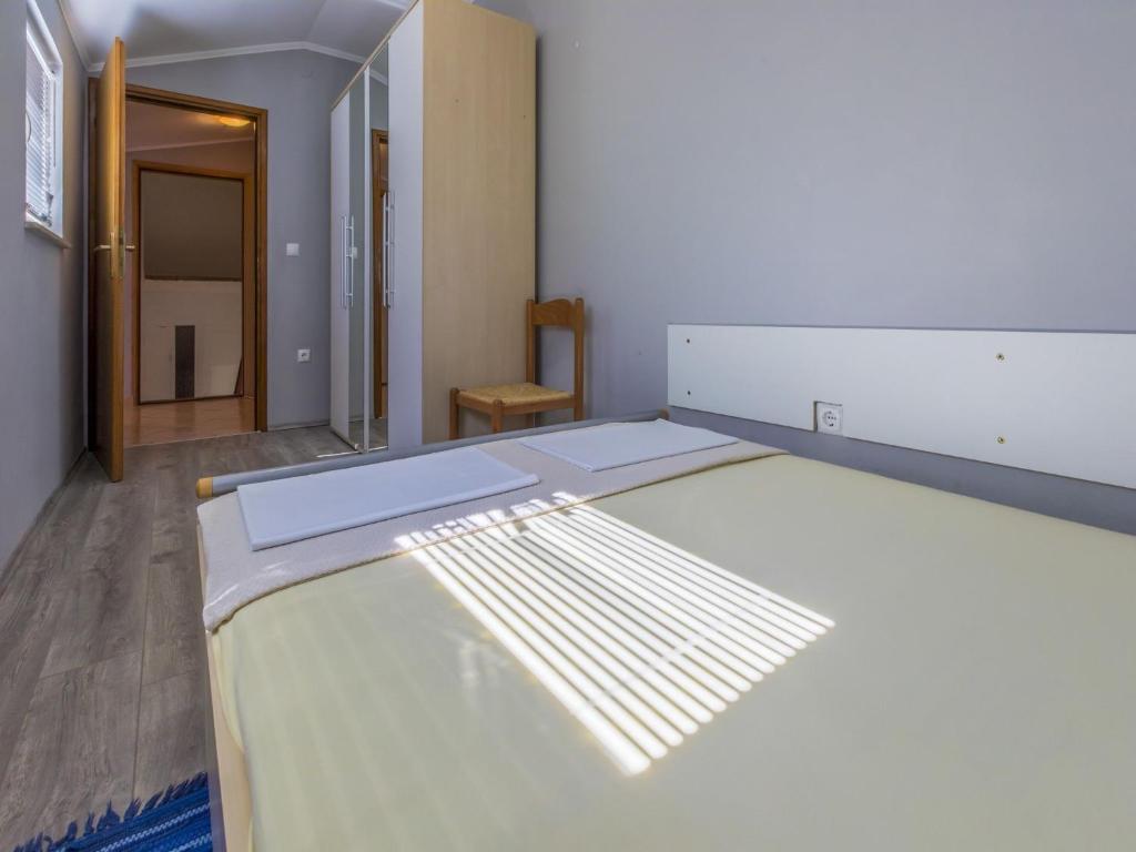 Postel nebo postele na pokoji v ubytování Apartment Heriban