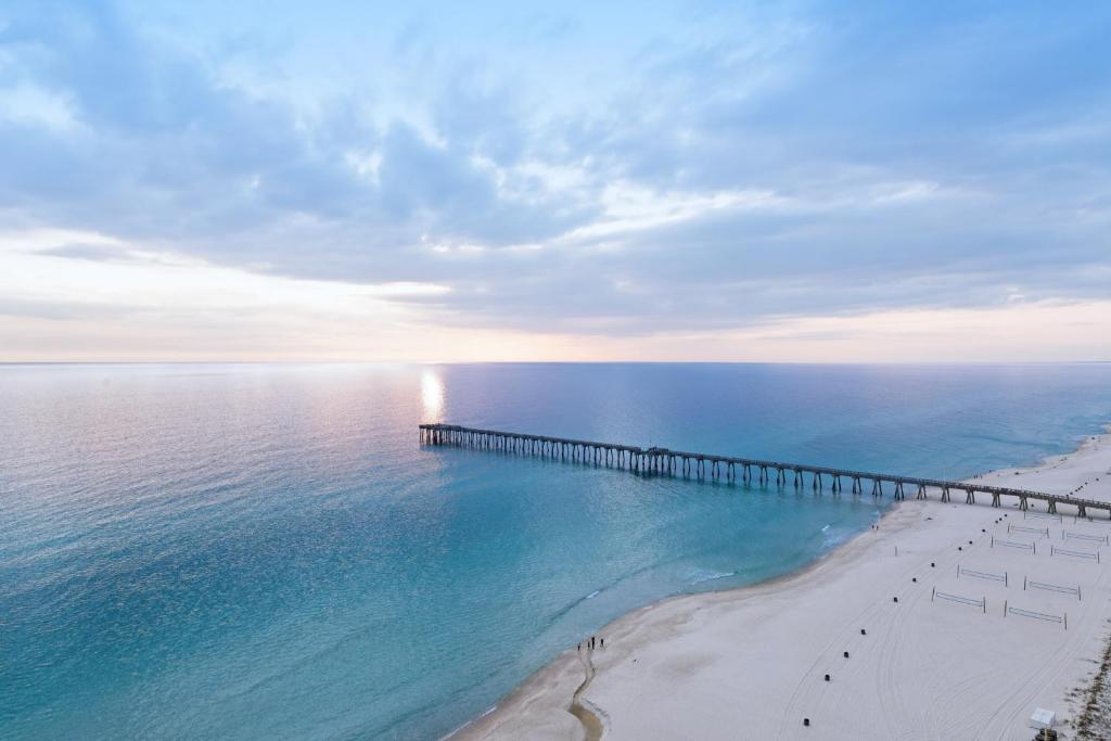 an aerial view of a beach with a pier at Calypso Resort 2 in Panama City Beach