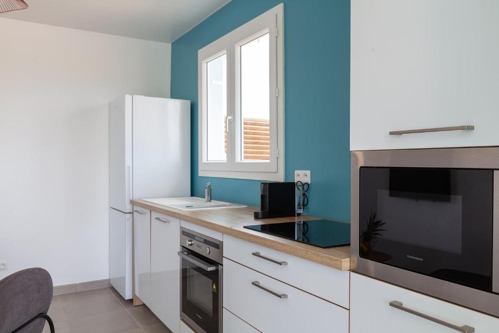 Kuchyň nebo kuchyňský kout v ubytování SeaCove & SeaSide Villas, classées 4 étoiles